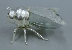 A silver-plated bee-form honey pot. 15 cm long.