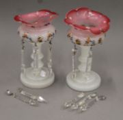 A pair of Victorian florally-painted glass lustres. Each 23.5 cm high.