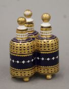 A Victorian porcelain triple scent bottle. 7.5 cm high.
