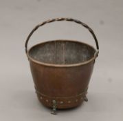 A Victorian copper coal bucket. 43 cm diameter.