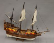 A large wooden model of a galleon. 80 cm long.