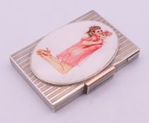 A silver compact case, the lid with an oval plaque depicting a 'glamour girl'. 8 x 5.5 cm.