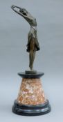 An Art Deco-style bronze of a dancing girl on marble plinth base. 49 cm high.