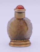 An unmarked silver gilt and agate snuff bottle and stopper. 8 cm high.