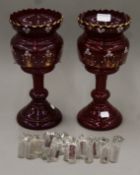 A pair of Victorian enamel-painted and gilt-heightened ruby glass lustres. 31.5 cm high.