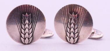 A pair of Georg Jensen silver cufflinks of wheatsheaf design, numbered 78B. 2.1 cm diameter.
