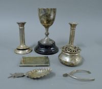 A quantity of silver items including a small trophy cup on stand, a potpourri pot,
