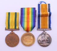 A group of WW I medals with ribbons,