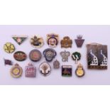 A collection of badges (Welsh Guards, British Legion, Girl Guides, Comrades of the Great War,