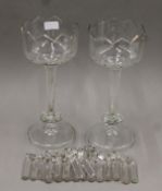 A pair of Victorian clear glass lustres. Each 33 cm high.