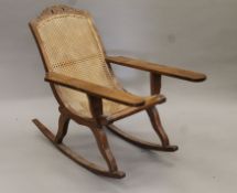 An early 20th century walnut plantation chair. 68.5 cm wide.