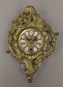 A 20th century cast brass wall clock. 28.5 cm high.