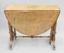 A Victorian walnut Sutherland table. 23 cm wide flaps down x 68 cm high.