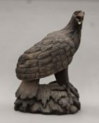 A large carved wooden model of an eagle. 47 cm high.