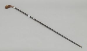 A silver-mounted Sunday stick. 92 cm high.