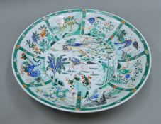 An 18th/19th Chinese famille verte dish with six-character mark to base. 42.5 cm diameter.
