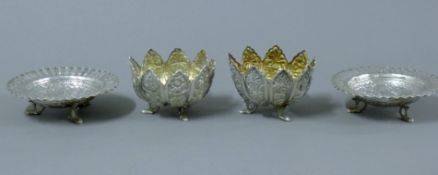 Two pairs of Indian silver footed bowls. The larger pair each 10.5 cm diameter. 245.5 grammes.