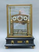 A Congreve clock. 40.5 cm high.