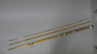 A Hardy Bros Wallis-Avon three-piece bamboo and split cane fly rod in its maker's canvas sleeve.