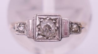 A 9 ct gold, platinum and diamond Art Deco ring. Ring size F/G. 1.6 total weight.