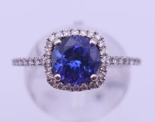 A 14 K white gold, tanzanite and diamond ring. Ring size O. 3.6 grammes total weight.