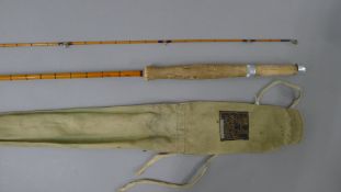 A 9' Hardy Bros The J J H Triumph Palakona split cane fly rod in its maker's canvas sleeve.