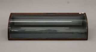 A Victorian mahogany bow glass display cabinet. 88 cm wide.