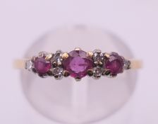 A 9 ct gold, diamond and ruby ring. Ring size M/N. 2.2 grammes total weight.