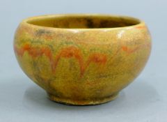 A Chinese small yellow pottery bowl. 9 cm diameter.
