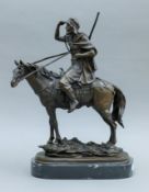 A bronze of an Arab on horseback. 36 cm high.
