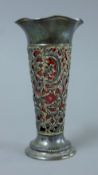 A cranberry glass-lined silver vase. 15 cm high. 71 grammes.