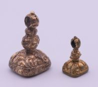 Two Victorian gilt fob seals, the smaller with thistle engraving, the larger with initials. 3.