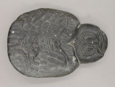 A tribal stone carving, possibly Inuit, formed as a turtle. The reverse inscribed 'N.
