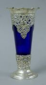 A silver Bristol blue glass lined vase. 18 cm high.