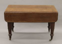 An early 19th century mahogany extending dining table. 101 cm long closed x 116 cm wide.