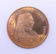 A boxed bronzed commemorative medallion celebrating Mary Queen of Scots produced by The Tower Mint.