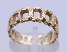 An 18 ct gold Bark effect ring, stamped 750. Ring size L. 4 grammes.
