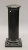 A 19th century ebonised wooden column with black slate base. 108 cm high.