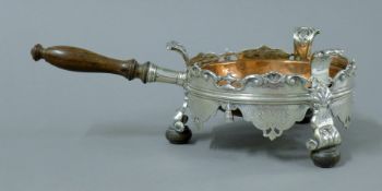 An early Dutch silver mounted copper saucepan with turned wooden handle and feet. 16.5 cm long.