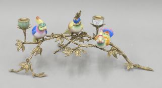 A candelabra formed as porcelain birds on gilt metal branches. 54 cm wide.