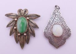 A silver filigree and jade clip brooch and an unmarked silver and opal pendant. Brooch 4.