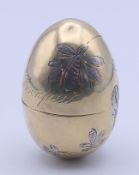 A Russian silver gilt egg form box engraved with flowers and 'Xpnctoc Bockpece' (Christ is Risen)