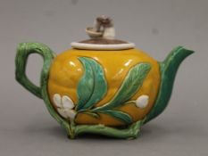 A Majolica porcelain tea pot. 17.5 cm long.