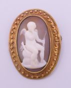 An unmarked yellow metal Victorian cameo brooch. 4 cm high.