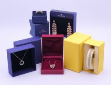 A small quantity of boxed Swarovski jewellery to include two pendant necklaces, a bracelet,