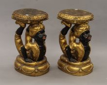 A pair of decorative resin stools of blackamoor form. Each 56 cm high.