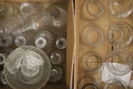A collection of cut glass, including decanters, a centre bowl, glass castor cups, etc.