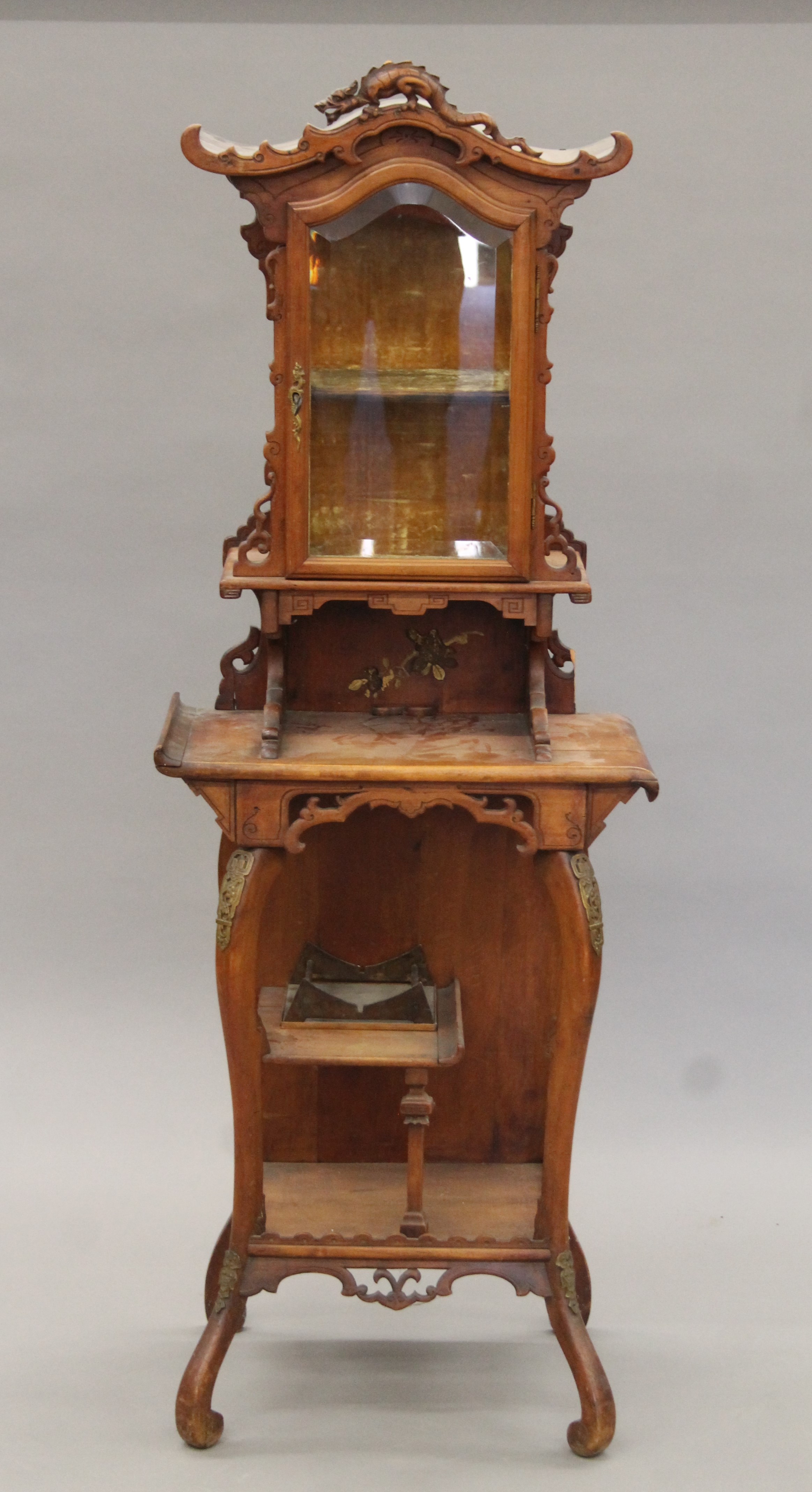 An early 20th century Continental side cabinet in the chinoiserie manner. 153 cm high x 55 cm wide.