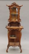 An early 20th century Continental side cabinet in the chinoiserie manner. 153 cm high x 55 cm wide.