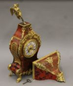 An ormolu-mounted bracket clock and matching bracket. The clock 63 cm high.